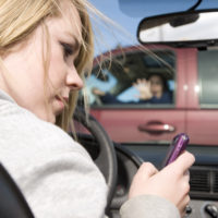 Girl texting while driving