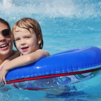 Mother with her son in a pool