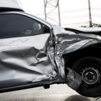 Grey truck hit on its side